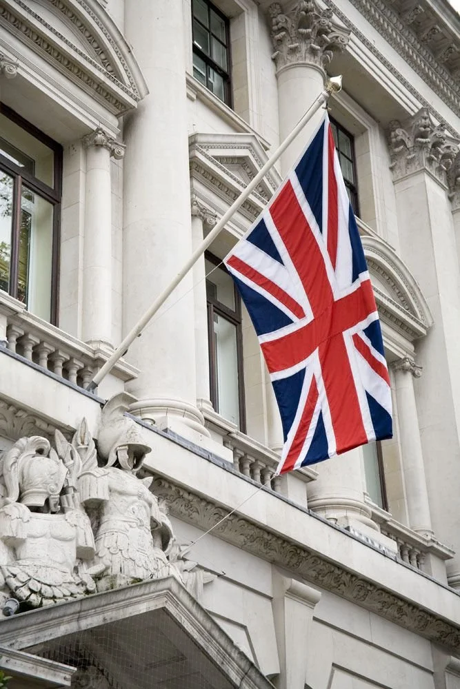 Union Jack flag outside a historic British building